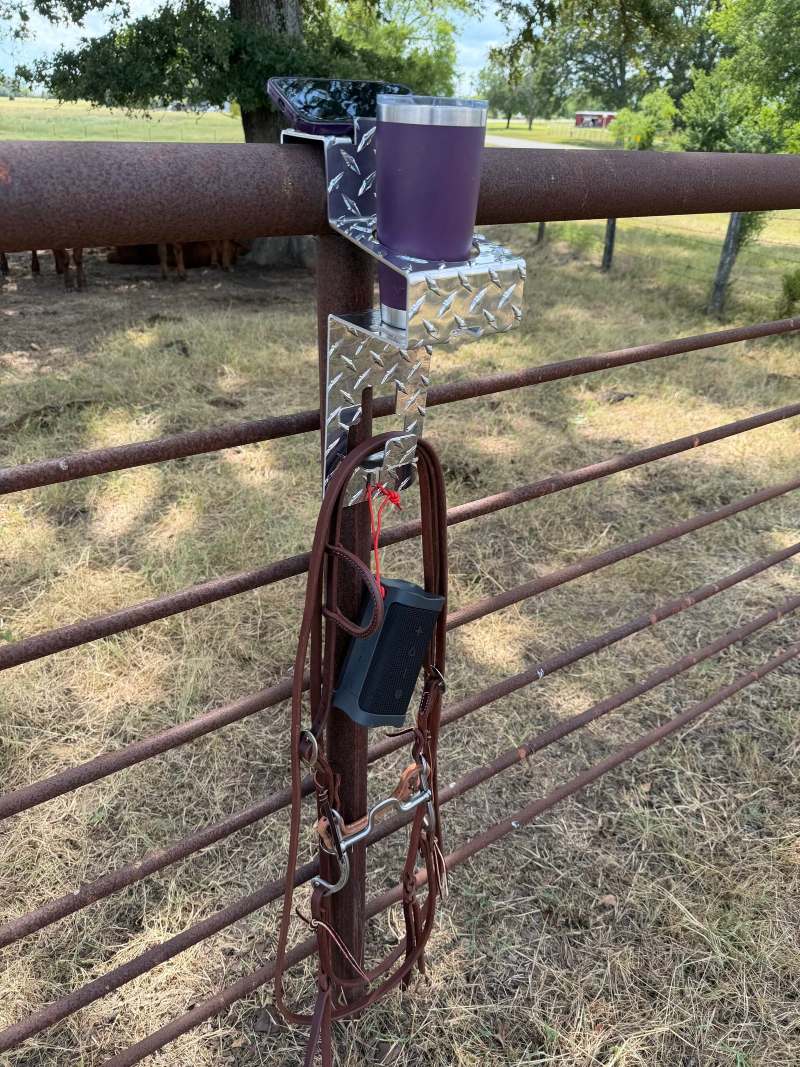 DrinkinBuddy with drink in holder and items hanging from the utility hook